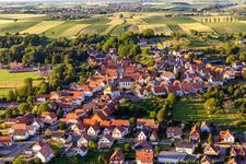 Agricultural land and field borders surround the settlement area of the village in Buhl in Grand Est, France