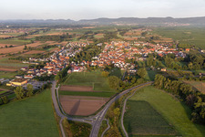 Oblique view of Agricultural land and field borders surround the settlement area of the village in Geinsheim in the state Rhineland-Palatinate, Germany