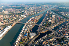 Quays and boat moorings at the port of the inland port Rhine-harbour and Kurt-Schuhmacher-bridge for the B44 crossing the Rhine to Ludwigshafen in Mannheim in the state Baden-Wurttemberg, Germany
