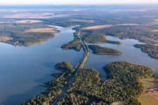 Course of the connecting canal Canal des Houlières de la Sarre through a lake in the forest in Langatte in the state Moselle, France