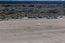 Buggies and kite surfers on the sandy beach in Fanø in the state South Denmark, Denmark