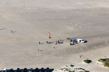 Buggies and kite surfers on the sandy beach in Fanø in the state South Denmark, Denmark out of the air