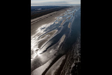 Aerial view of Cars riding on the Beach along the West coast of Northsea island in Fanoe in, Denmark