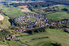 Aerial view of Agricultural land and field borders surround the settlement area of the village in Hoppetenzell in the state Baden-Wurttemberg, Germany