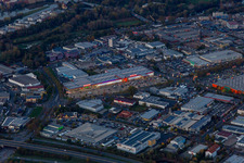 Building of the construction market BAUHAUS Schweinfurt and Marktkauf Schweinfurt at dusk in Schweinfurt in the state Bavaria, Germany