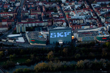 Building of the shopping center Stadtgalerie Schweinfurt and illumated SKF Hochhaus at dawn in Schweinfurt in the state Bavaria, Germany