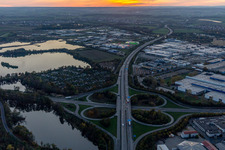 Aerial view of Sunset traffic flow at the intersection- motorway A 7 Exit Centre in Schweinfurt in the state Bavaria, Germany