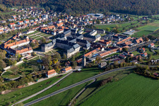 Aerial photograpy of Complex of buildings of the monastery Ebrach with Kaisersaal and Monastery church Ebrach and Correctional facility Ebrach in Ebrach in the state Bavaria, Germany