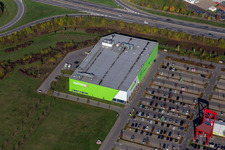 XXXL-sized chair on the parkinkg of the furniture market XXXLutz Neubert Schweinfurt in Gewebegebiet Maintal in Schweinfurt in the state Bavaria, Germany