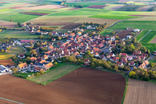 Aerial view of Agricultural land and field borders surround the settlement area of the village in Neuses a.Berg in the state Bavaria, Germany