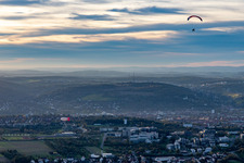 Zeppelin and paraglider over Galgenberg in Gerbrunn in the state Bavaria, Germany