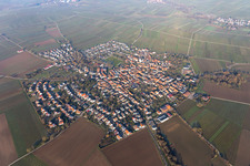 Agricultural land and field borders surround the settlement area of the village in Moerzheim in the state Rhineland-Palatinate, Germany viewn from the air