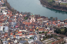 Church building St. Fridolin in the Old Town- center of downtown in Bad Saeckingen in the state Baden-Wurttemberg. The historic wooden bridge over the river Rhine connects Germany with Switzerland and Novartis Stein