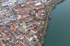 Aerial view of Church building St. Fridolin in the Old Town- center of downtown in Bad Saeckingen in the state Baden-Wurttemberg. The historic wooden bridge over the river Rhine connects Germany with Switzerland and Novartis Stein