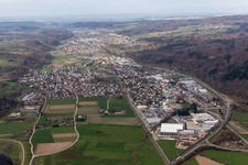 Location view of the streets and houses of residential areas in the valley landscape of the Wiese river surrounded by mountains in Maulburg in the state Baden-Wuerttemberg, Germany
