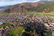Aerial view of Location view of the streets and houses of residential areas in the valley of the Kinzig landscape surrounded by mountains in Steinach in the state Baden-Wuerttemberg, Germany