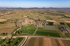 Village - view on the edge of agricultural fields and farmland in Impflingen in the state Rhineland-Palatinate, Germany