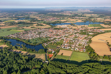 Village - view on the edge of agricultural fields and farmland in Leimersheim in the state Rhineland-Palatinate