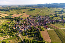 Aerial view of Agricultural land and field borders surround the settlement area of the village in Goecklingen in the state Rhineland-Palatinate, Germany