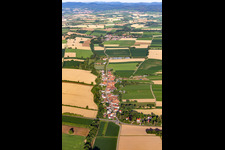 Aerial photograpy of Agricultural land and field borders surround the settlement area of the village in Vollmersweiler in the state Rhineland-Palatinate, Germany