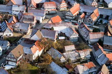 Wintery snow-covered half-timbered houses in the old town area in Hunspach in the state Bas-Rhin, France