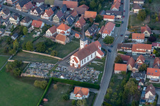 Grave rows on the grounds of the cemetery and catholic Church Saint-Martin in Seebach in Grand Est, France
