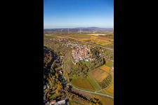 Autumnal discolored vegetation view town center on the edge of vineyards and wineries in the wine-growing area in Neuleiningen in the state Rhineland-Palatinate, Germany out of the air