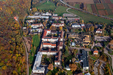 Autumnal discolored vegetation view of hospital grounds of the Clinic Klinik fuer Kinder-/Jugendpsychiatrie and -psychotherapie in the district Pfalzklinik Landeck in Klingenmuenster in the state Rhineland-Palatinate, Germany