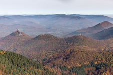 Autumnal discolored vegetation view of castle of the fortresses Trifels, Scharfeneck and Anebos at sunset in Annweiler am Trifels in the state Rhineland-Palatinate, Germany
