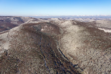 Winter aerial view in the snow of the Dierbachtal with Stäffelsberg tower in Oberotterbach in the state Rhineland-Palatinate, Germany
