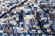 Winter aerial view in the snow of the monastery Klingenmünster in Klingenmünster in the state Rhineland-Palatinate, Germany