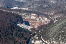 Winter aerial view in the snow of the PfalzGranit quarry in Waldhambach in the state Rhineland-Palatinate, Germany