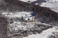 Winter aerial view in the snow from Slevogthof in Leinsweiler in the state Rhineland-Palatinate, Germany