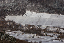 Winter aerial photograph in the snow of a paraglider landing in the Ranschbachtal in Ranschbach in the state Rhineland-Palatinate, Germany