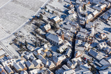 Winter aerial photograph in the snow of the Catholic parish and pilgrimage church Ranschbach in Ranschbach in the state Rhineland-Palatinate, Germany