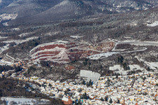 Winter aerial view in the snow of the Basalt-AG quarry in Albersweiler in the state Rhineland-Palatinate, Germany