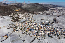 Aerial view of Wintry snowy Village - view on the edge of wine yards in Frankweiler in the state Rhineland-Palatinate, Germany
