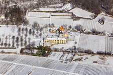 Wintry snowy complex of the hotel building Wohlfuehlhotel Alte Rebschule and Gasthaus Sesel in springtime in Rhodt unter Rietburg in the state Rhineland-Palatinate, Germany