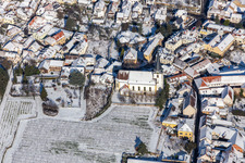 Winter aerial view in the snow of the Catholic Church of St. Jakob in the district Hambach an der Weinstraße in Neustadt an der Weinstraße in the state Rhineland-Palatinate, Germany
