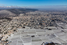Wintry snowy village - view on the edge of wine yards in the district Hambach in Neustadt an der Weinstrasse in the state Rhineland-Palatinate, Germany