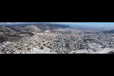 Panorama winter aerial view in the snow in Neustadt an der Weinstraße in the state Rhineland-Palatinate, Germany