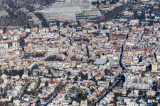 Winter aerial view in the snow with Catholic Parish Church of St. Mary and Protestant Collegiate Church in Neustadt an der Weinstraße in the state Rhineland-Palatinate, Germany