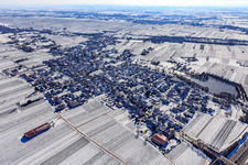 Winter aerial view in the snow with castle pond in Kirrweiler in the state Rhineland-Palatinate, Germany
