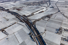 Winter aerial view in the snow, motorway exit Landau Nord in the district Dammheim in Landau in der Pfalz in the state Rhineland-Palatinate, Germany