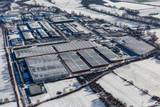 Wintry snowy industrial and commercial area Landau Ost with Michelin Tires and APL Automobil-Prueftechnik Landau GmbH in Landau in der Pfalz in the state Rhineland-Palatinate, Germany