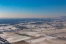 Wintry snowy wind turbine windmills on a field in Freckenfeld in the state Rhineland-Palatinate, Germany