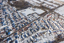 Winter aerial view in the snow Steinweilerer Straße in Winden in the state Rhineland-Palatinate, Germany