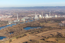 Power plants and exhaust towers of coal thermal power station Grosskraftwerk Mannheim AG at the shore of the Rhine river near Neckarau in Mannheim in the state Baden-Wurttemberg, Germany