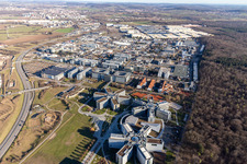 Star-shaped office buildings of the SAP Deutschland SE & Co. KG at the forest edged in Walldorf in the state Baden-Wuerttemberg viewn from the air