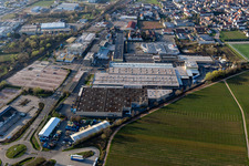 Oblique view of Building and production halls on the premises of Tenneco Automotive Deutschland GmbH in Edenkoben in the state Rhineland-Palatinate